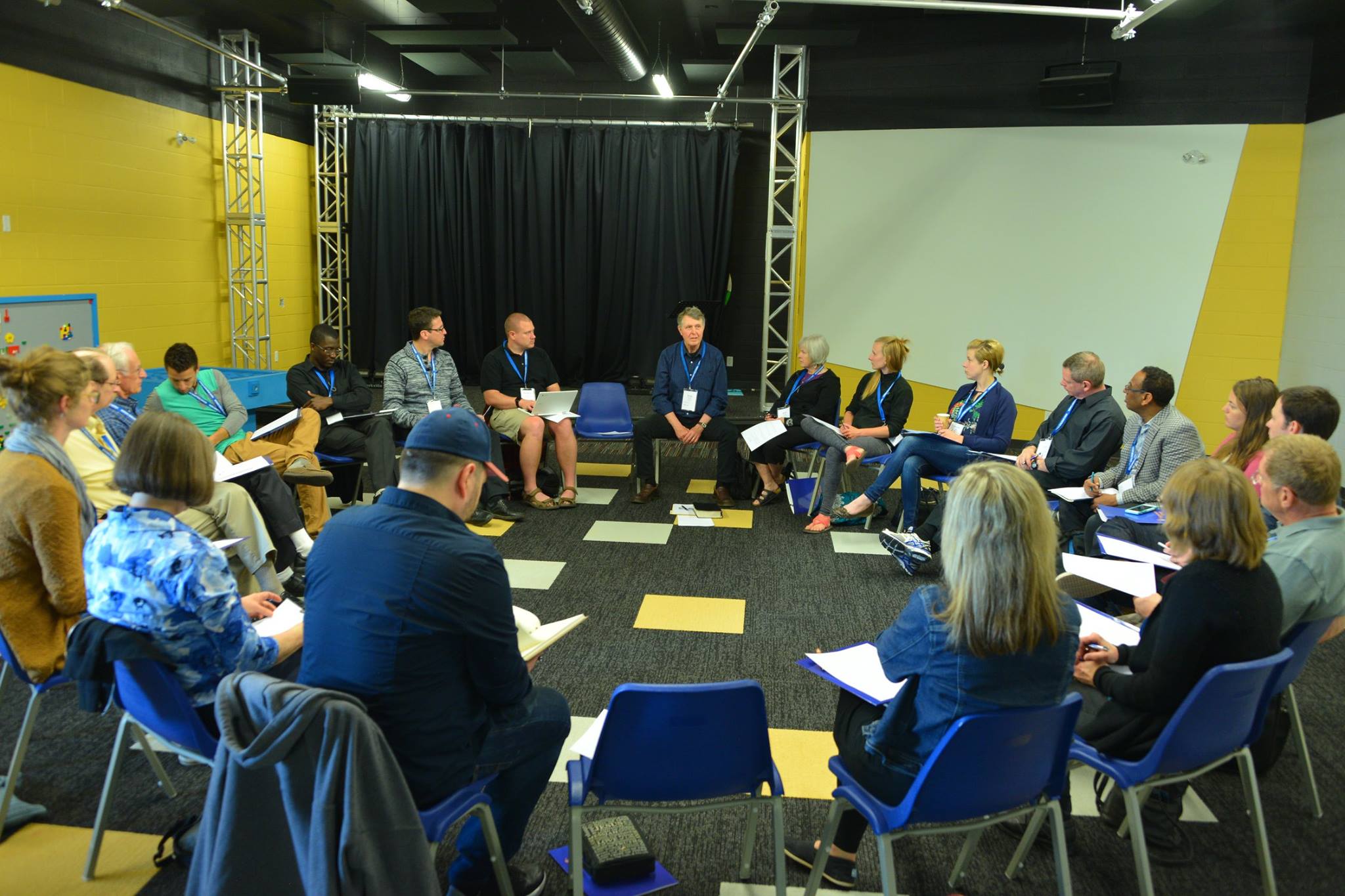 Men's group gathered in discussion circle for Bible study and accountability